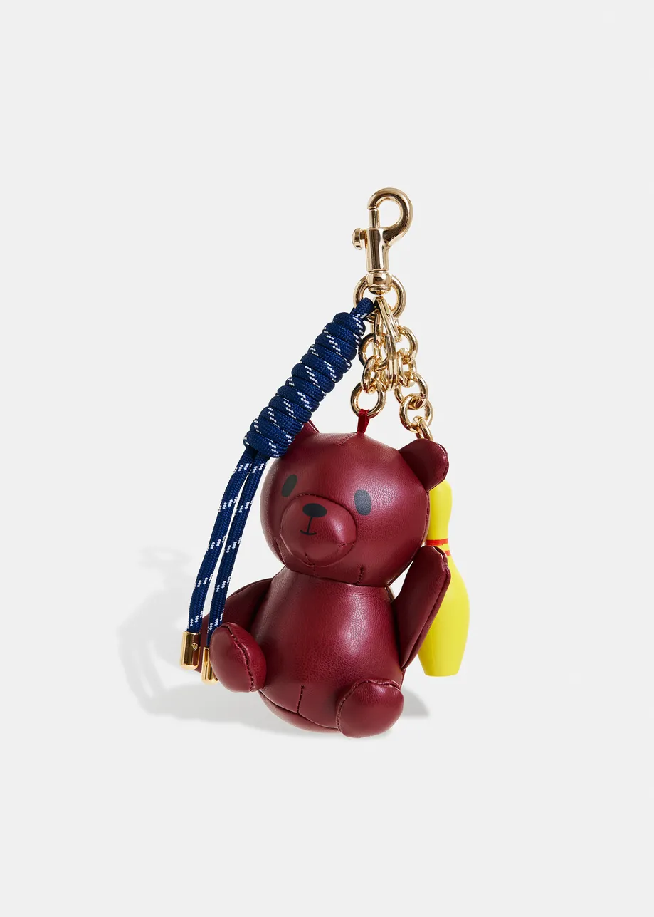Breloque de sac bordeaux, jaune et bleu foncé avec ours et quille