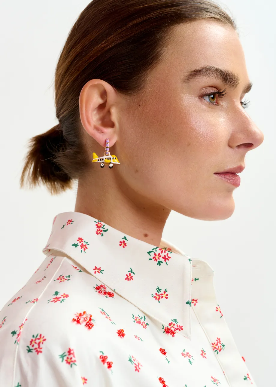 Gold and purple hoop earrings with plane and heart pendants