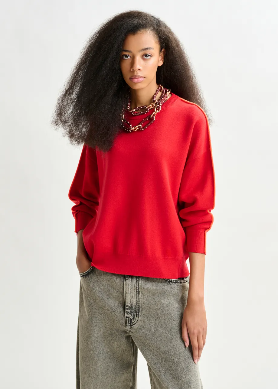 Red and orange knitted sweater with fitted waist