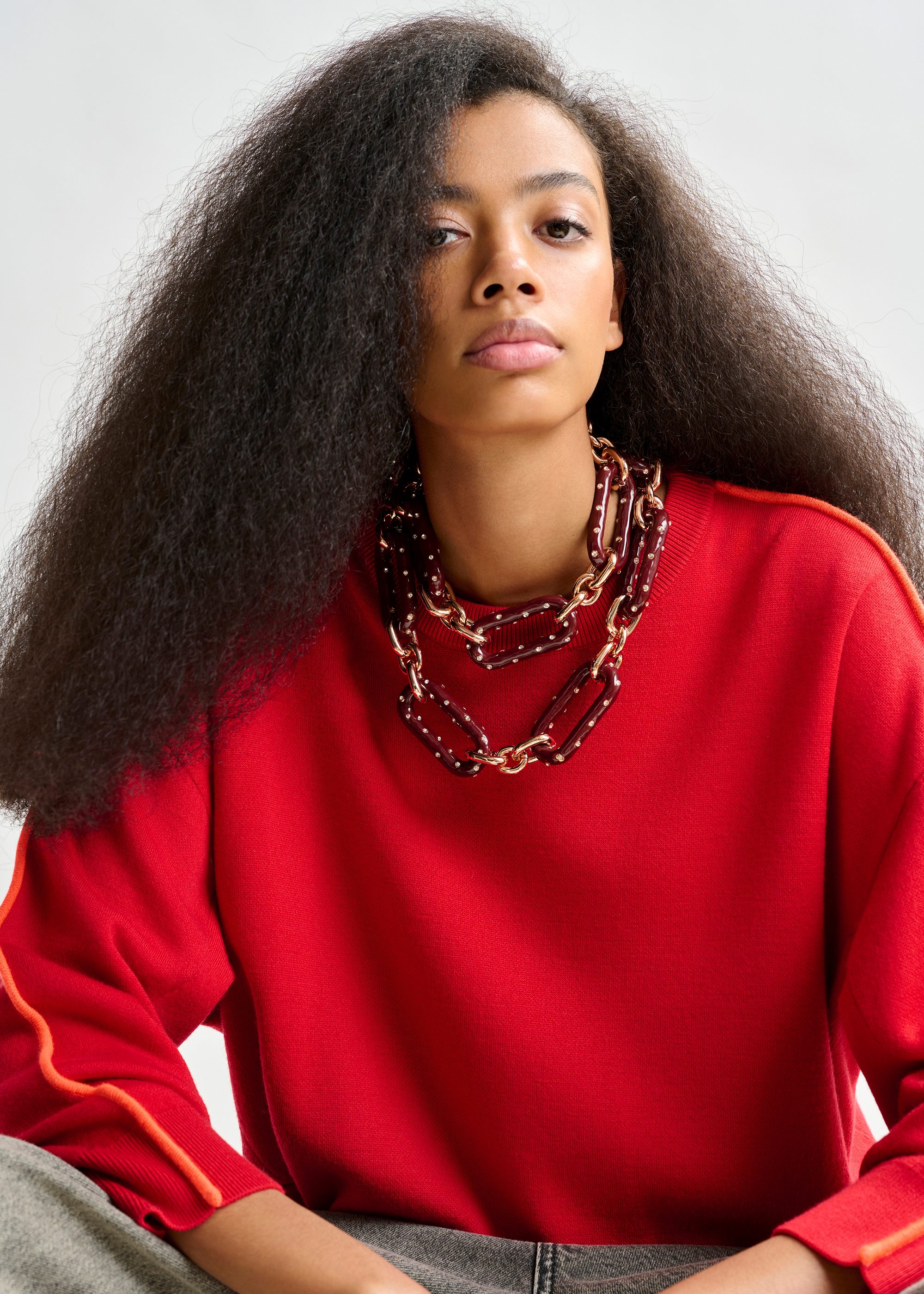 Rode trui met oranje accent | Essentiel Antwerp Nederland