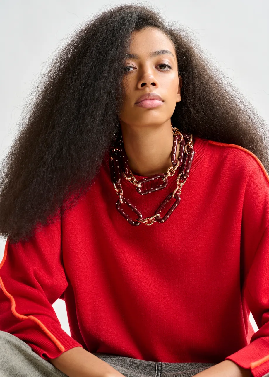 Red and orange knitted sweater with fitted waist