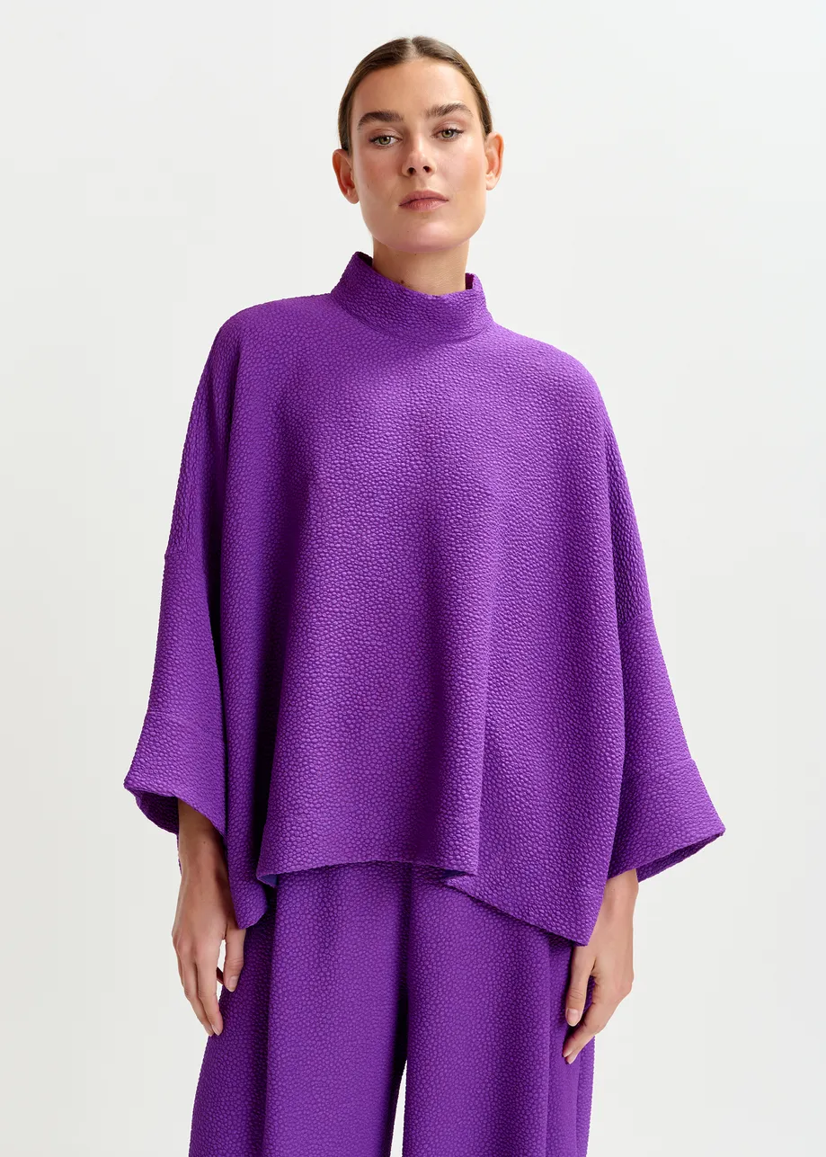Purple oversized top with stand-up collar