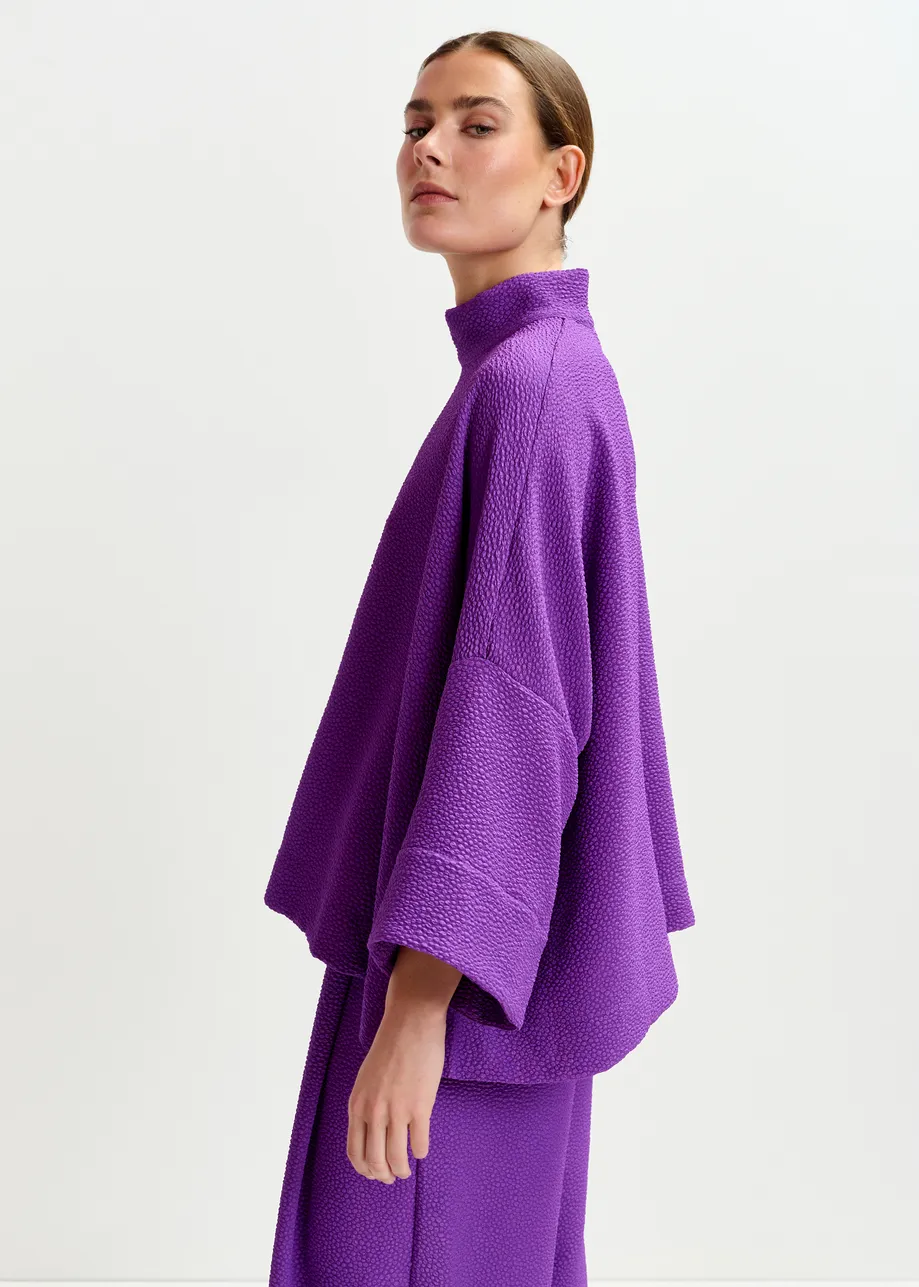 Purple oversized top with stand-up collar