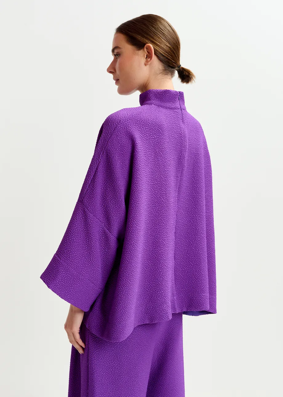 Purple oversized top with stand-up collar