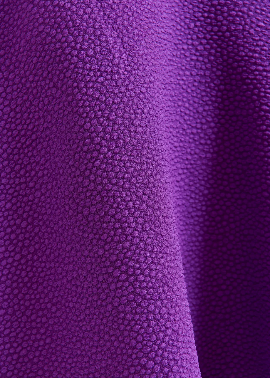Purple oversized top with stand-up collar