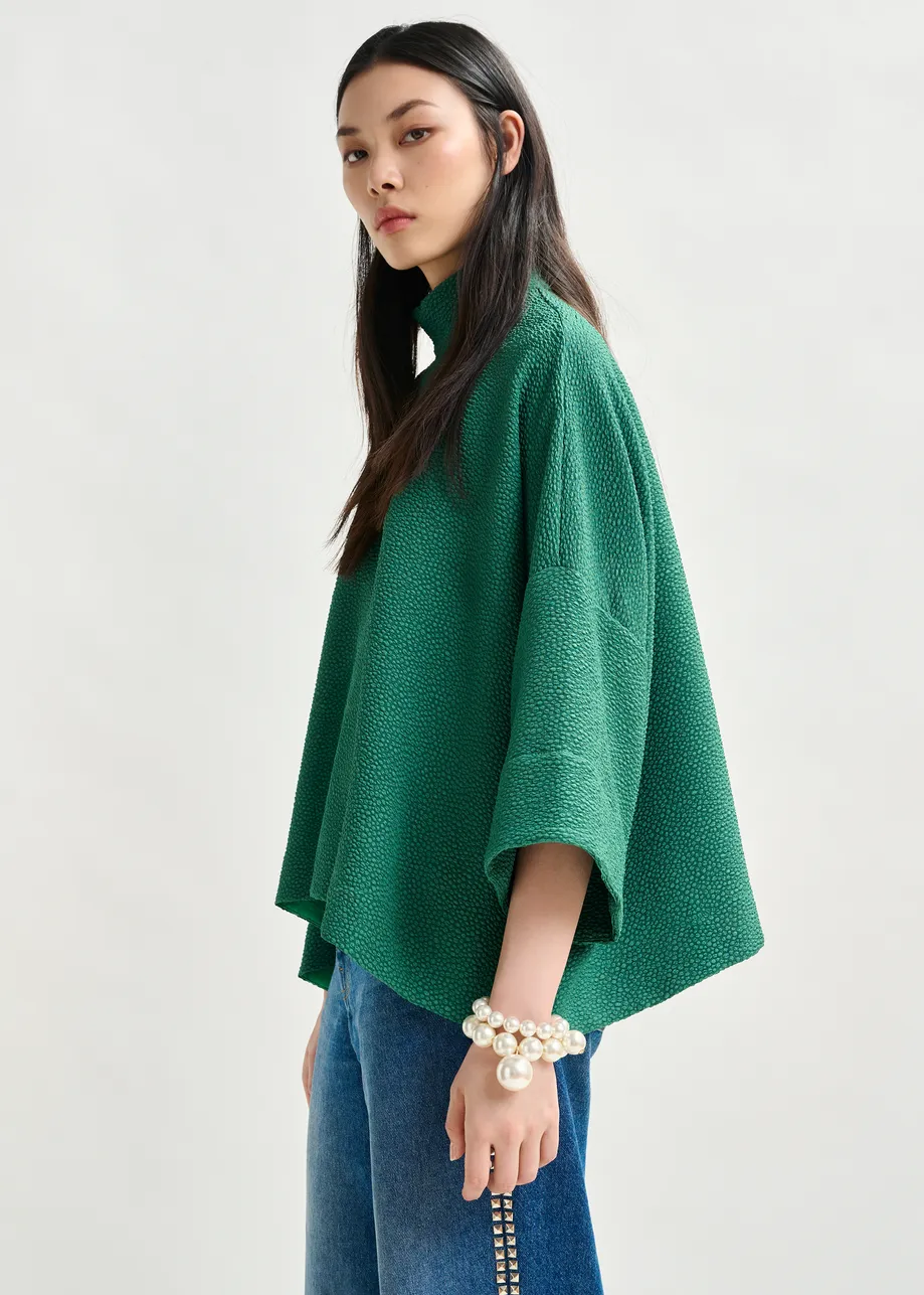 Green oversized top with stand-up collar