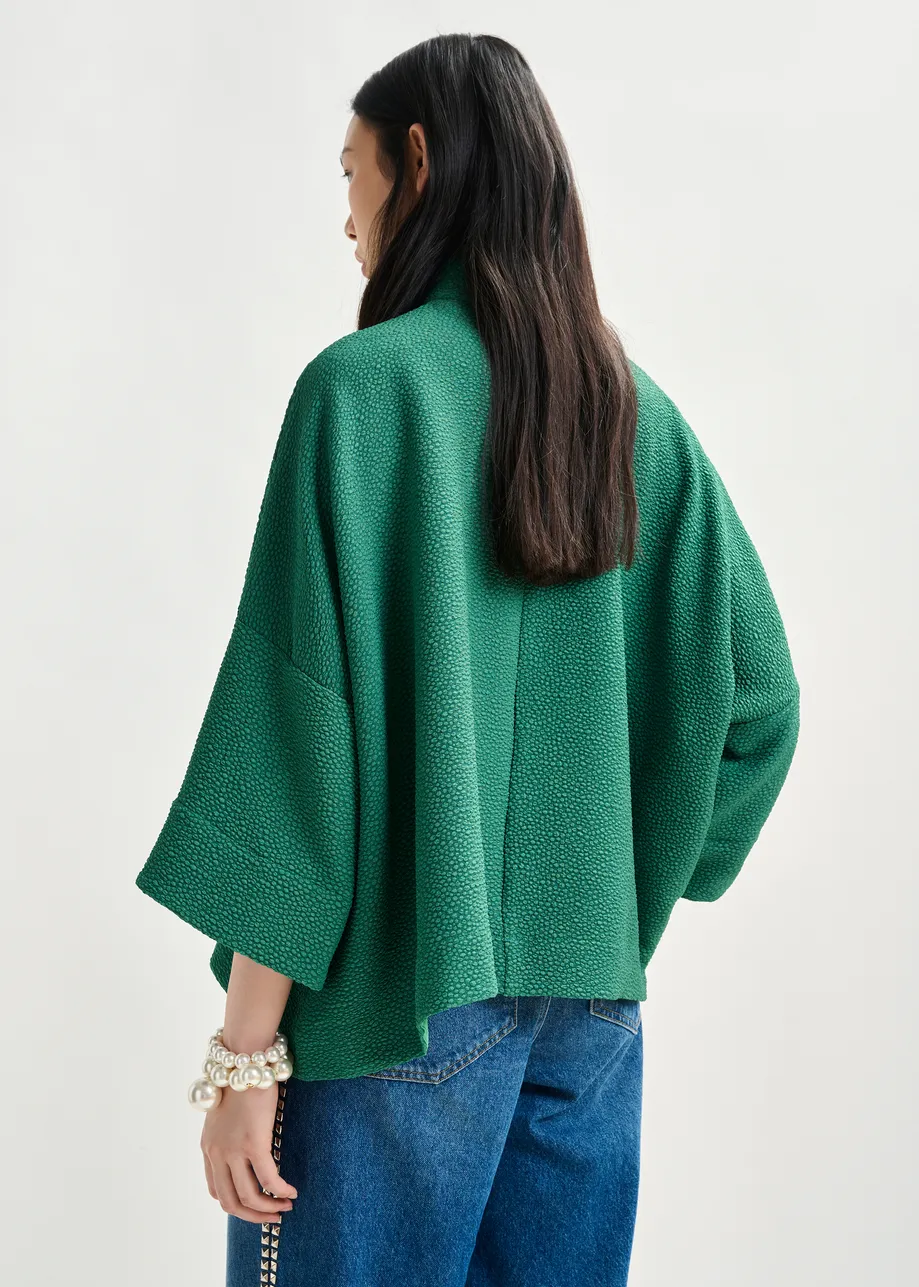 Green oversized top with stand-up collar
