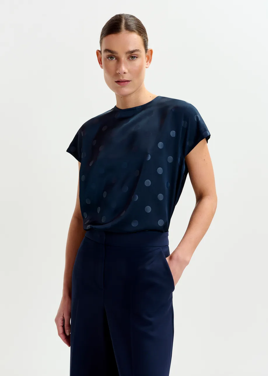 Navy polkadot top with cap sleeves