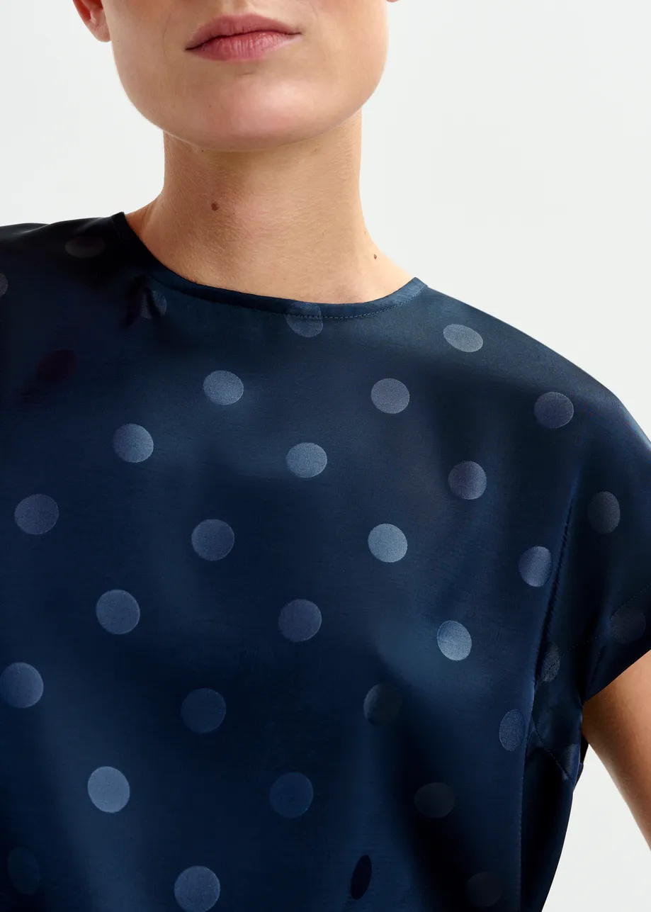 Navy polkadot top with cap sleeves