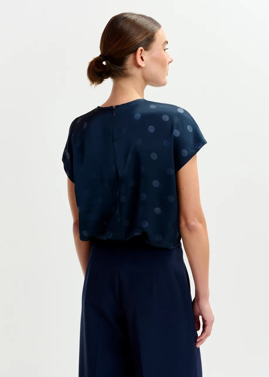Navy polkadot top with cap sleeves