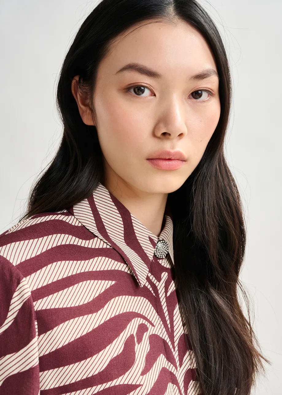 Off-white and burgundy zebra-jacquard shirt with rhinestone-encrushed button