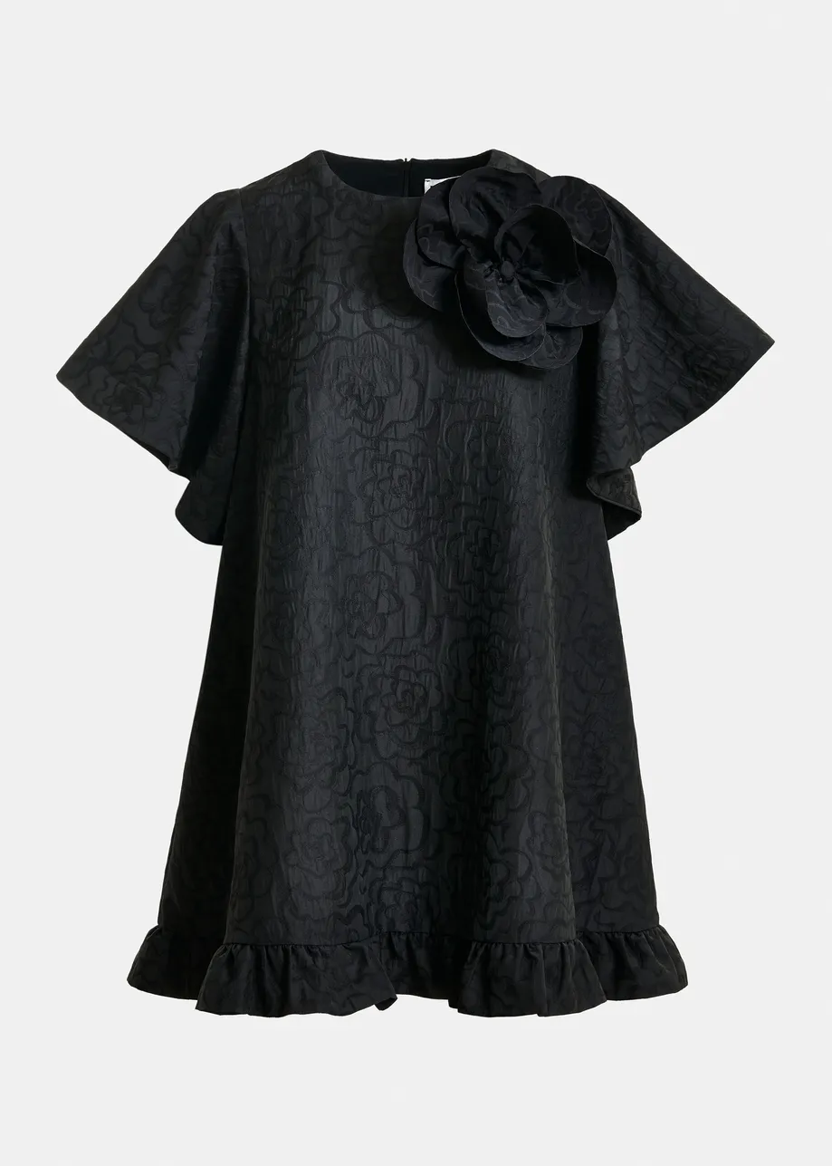 Black jacquard A-line mini dress with flower brooch