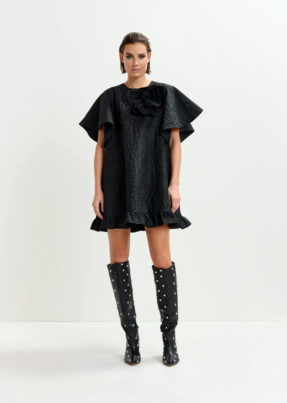 Black jacquard A-line mini dress with flower brooch