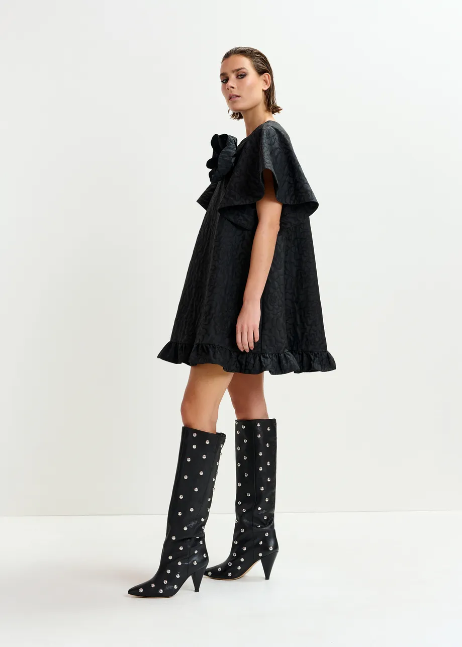 Black jacquard A-line mini dress with flower brooch