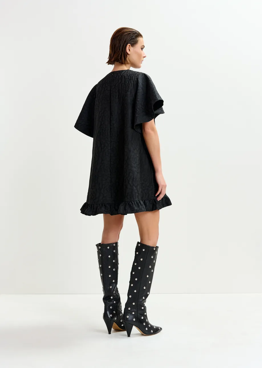 Black jacquard A-line mini dress with flower brooch