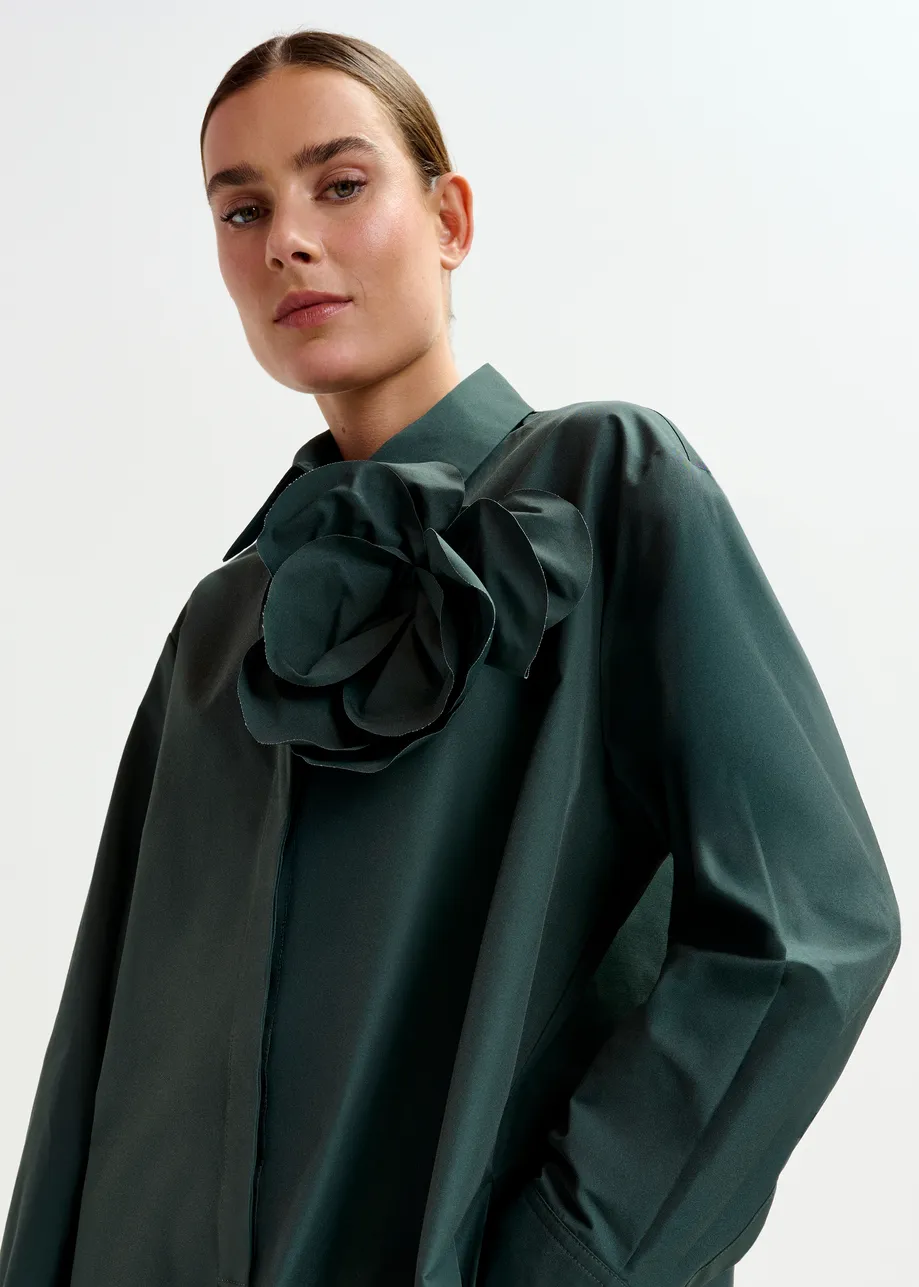 Dark teal green ruffled mini shirt dress with self-fabric flower
