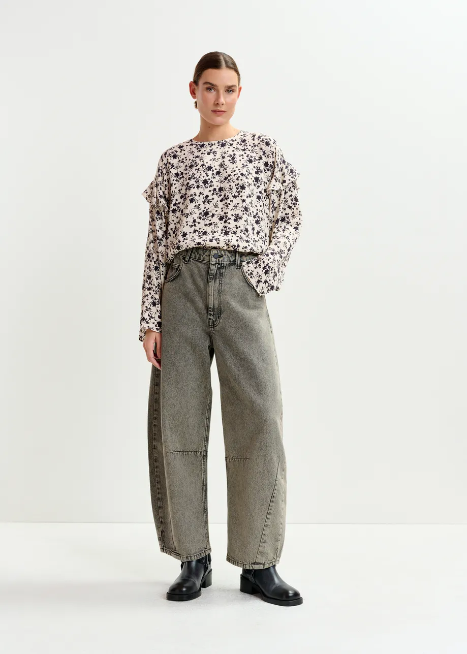 Off-white and black floral top with ruffle detail