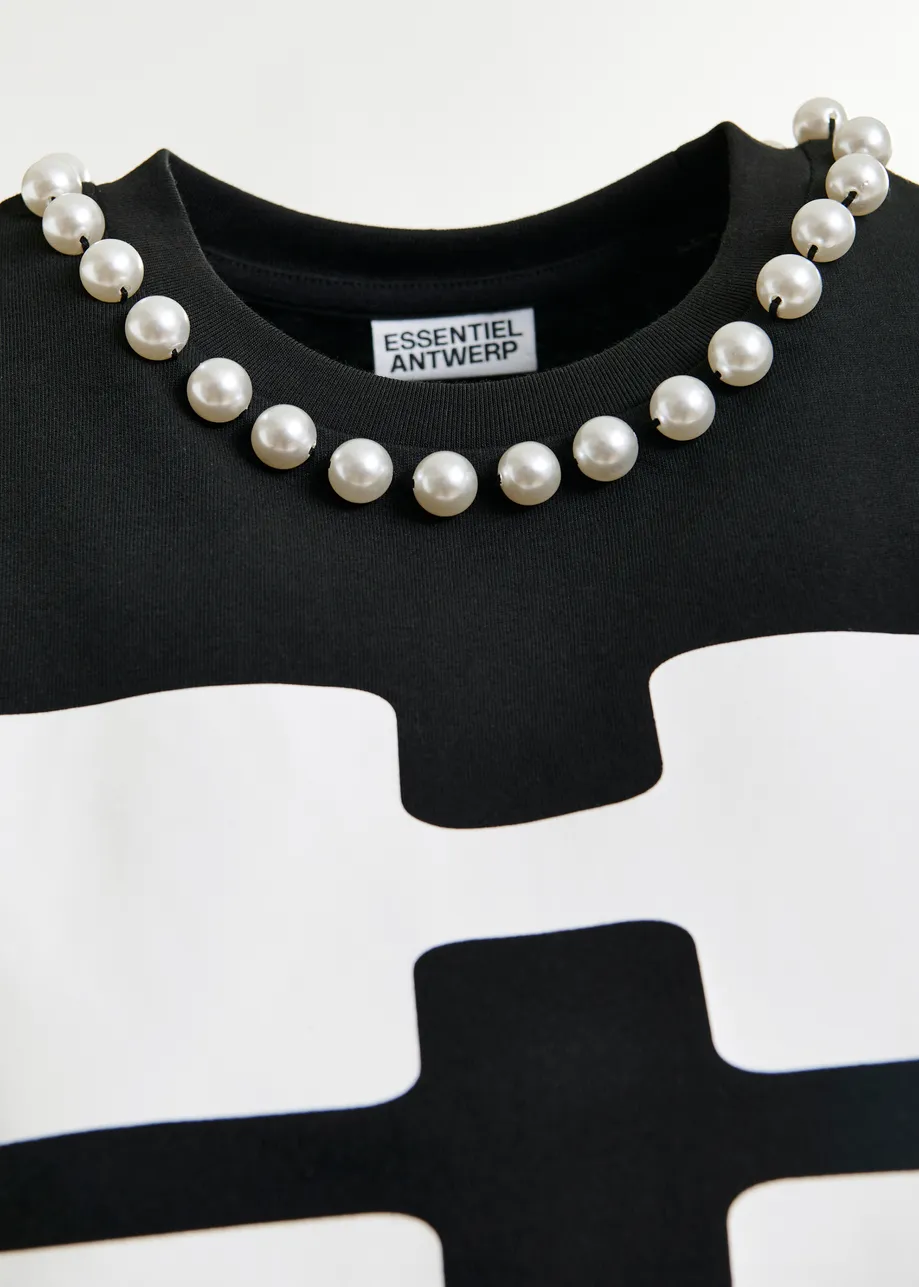 Black and white cotton T-shirt with "HUH?"- print and bead embellishments