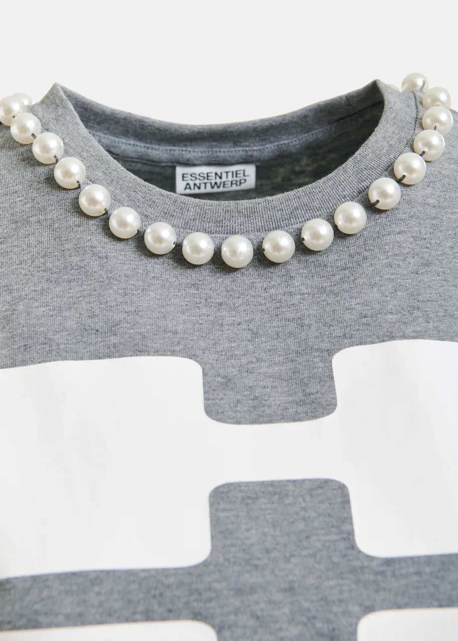 Red and white cotton T-shirt with "HUH?"- print and bead embellishments