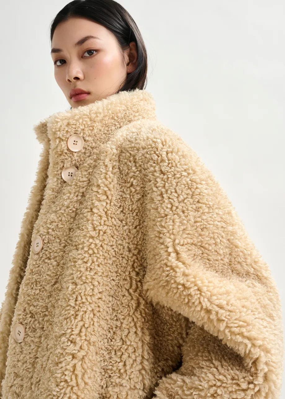 Off-white oversized faux shearling coat with stand-up collar