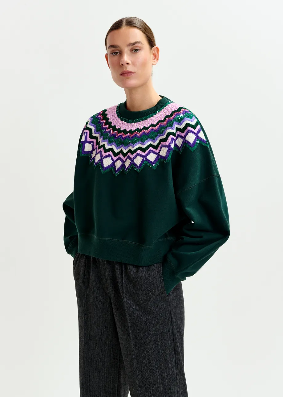 Donkergroene sweater met veelkleurige pailletten
