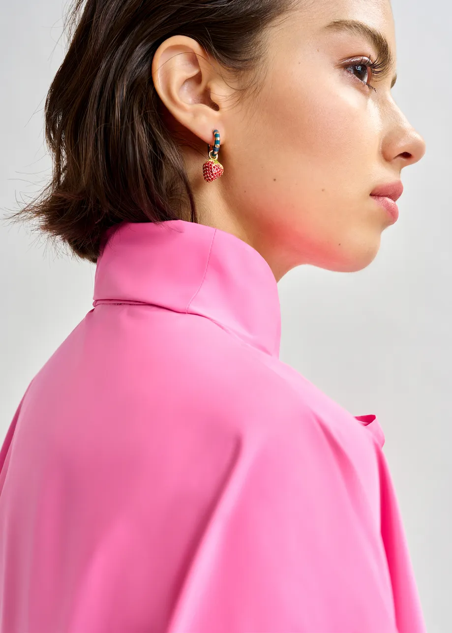 Gold and blue hoop earrings with dinosaur and strawberry pendants