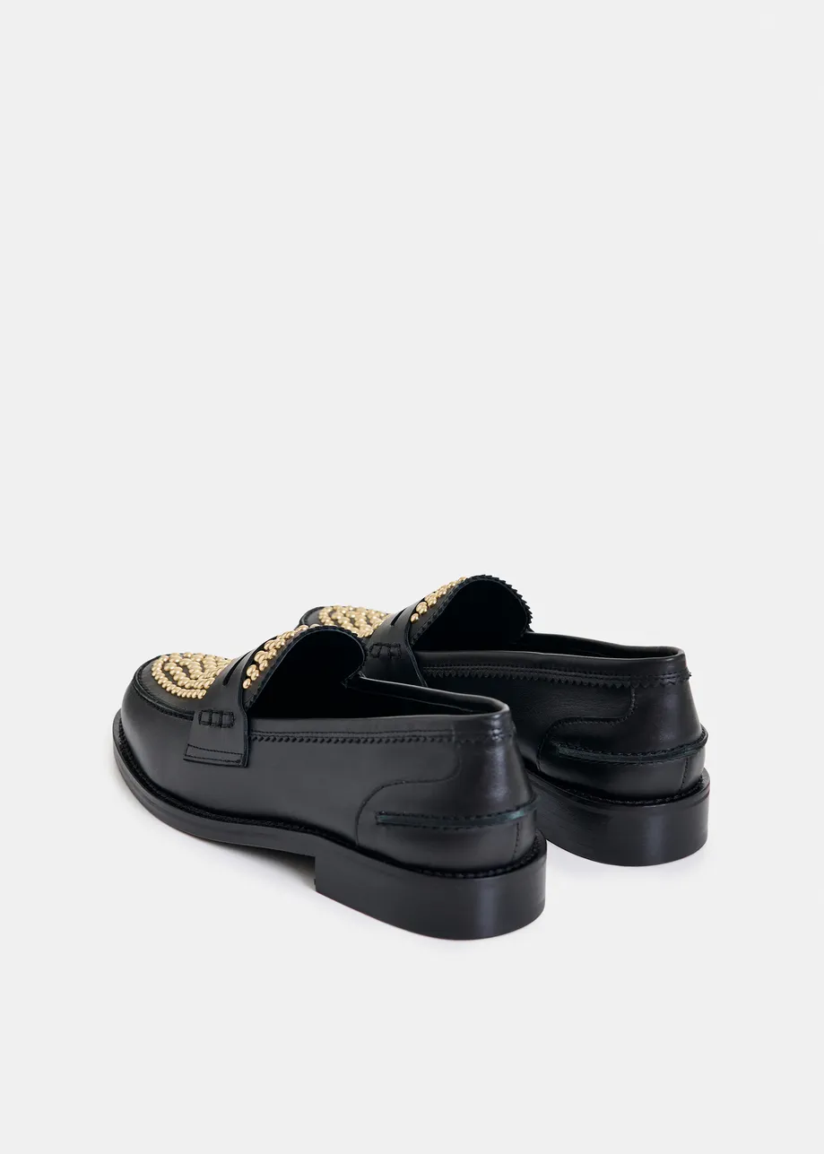 Black and gold leather loafers with stud embellishments