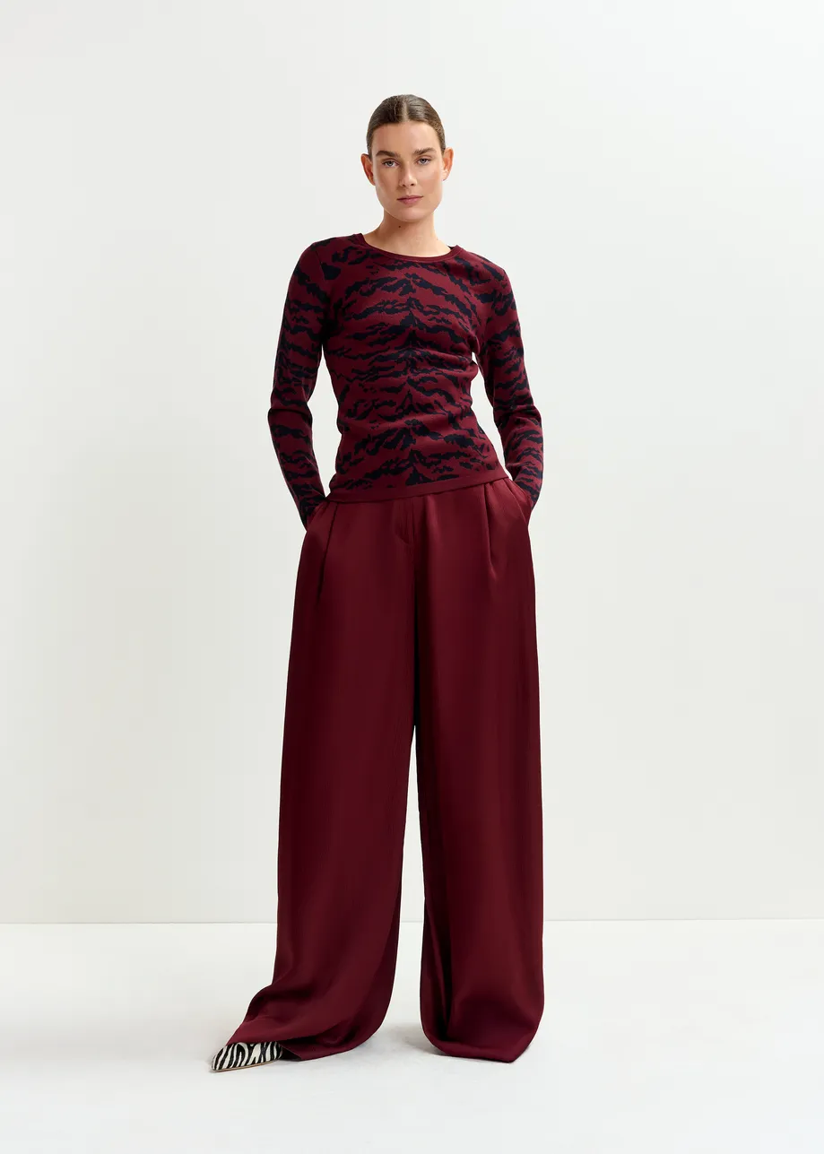 Burgundy and black zebra-print knitted sweater