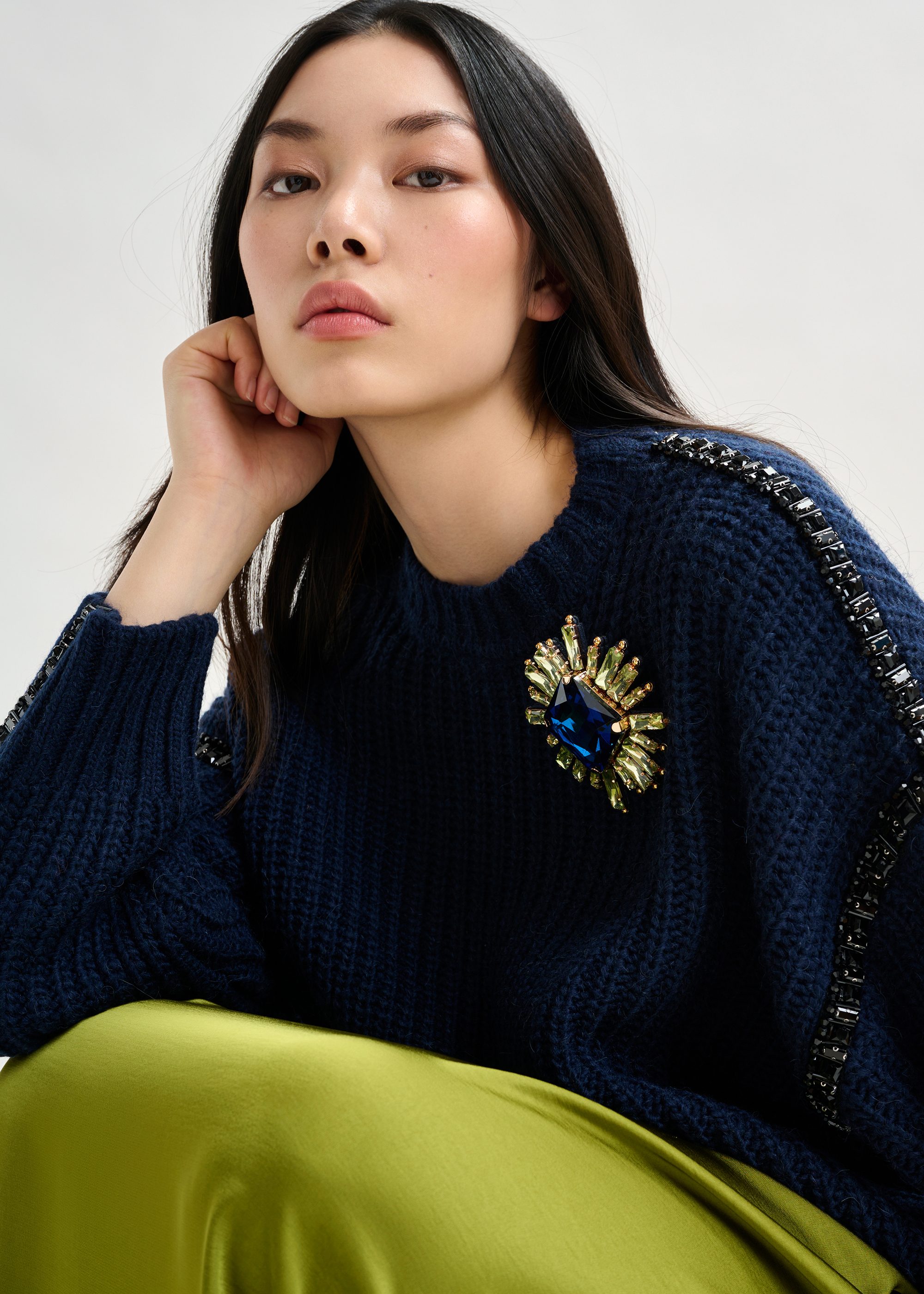 Navy wool-blend turtleneck with detachable collar and rhinestone