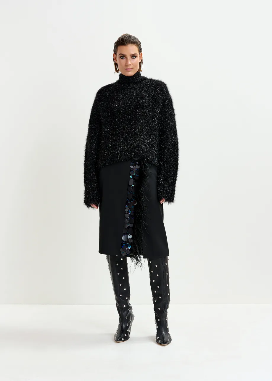 Zwarte midirok met pailletten en veren