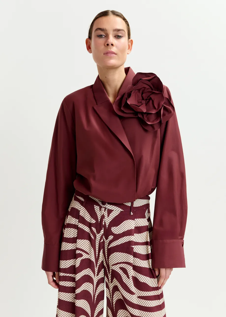 Burgundy bodysuit with self-fabric flower
