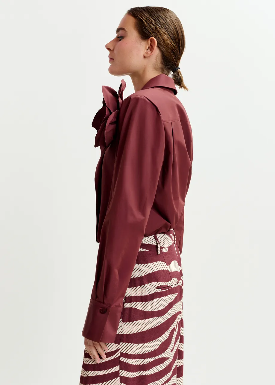 Burgundy bodysuit with self-fabric flower