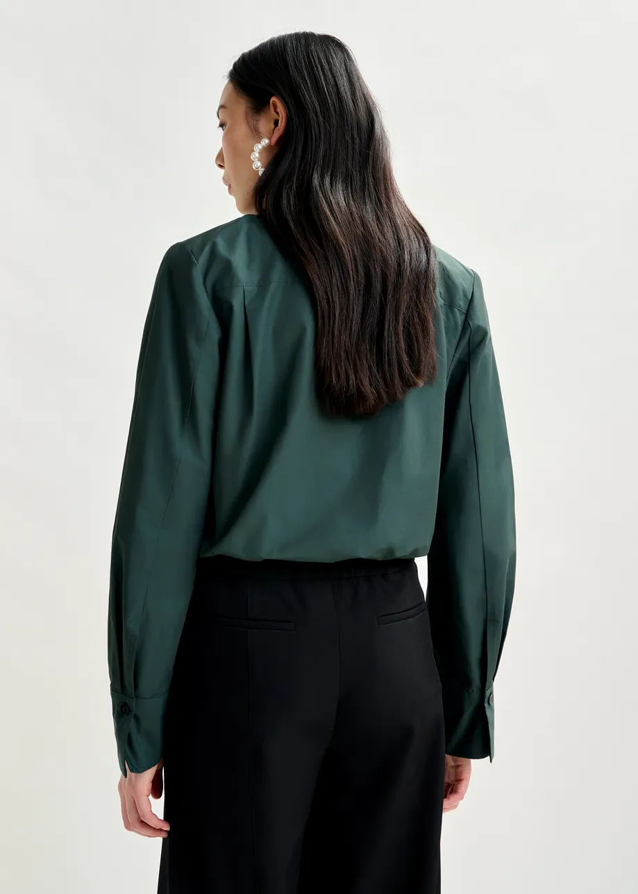 Dark teal green bodysuit with self-fabric flower