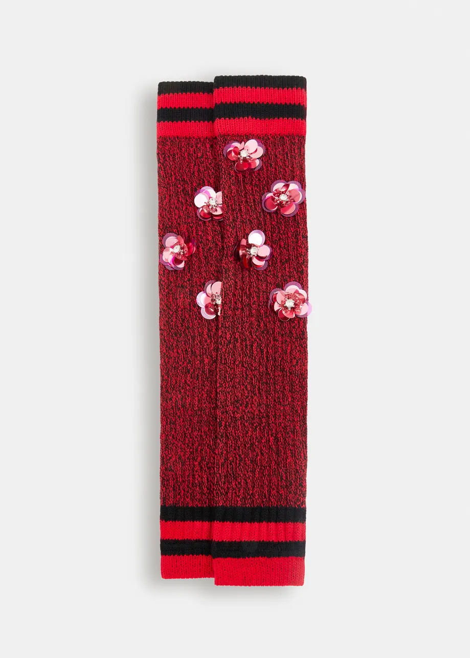 Red, black and pink rib-knitted warmers with rhinestone and sequin embellishments
