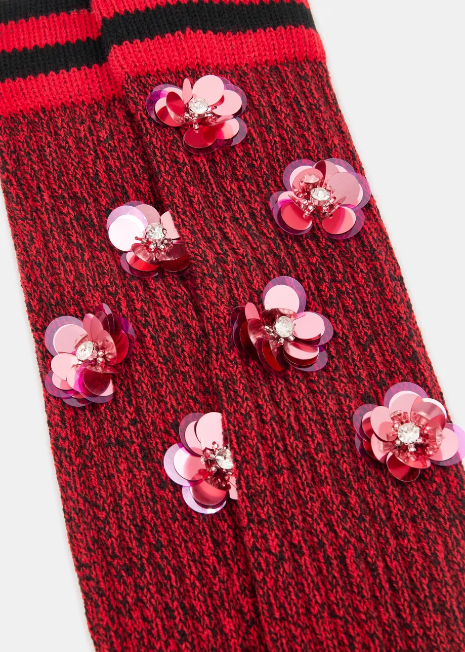 Red, black and pink rib-knitted warmers with rhinestone and sequin embellishments
