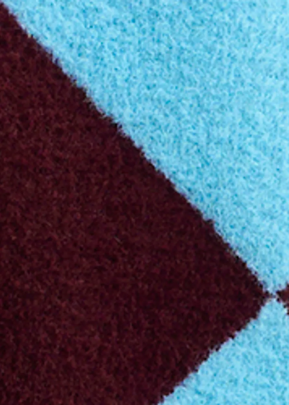 Blauwe en bordeaux cardigan in harlekijnmotief met bloemknopen