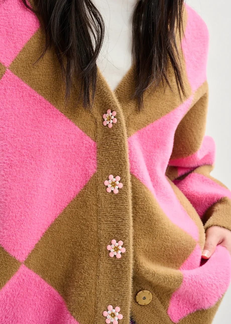 Brown and pink harlequin-patterned knit cardigan with flower-shaped buttons