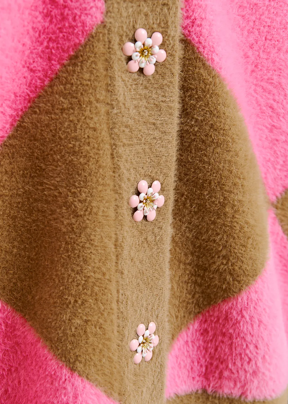 Brown and pink harlequin-patterned knit cardigan with flower-shaped buttons