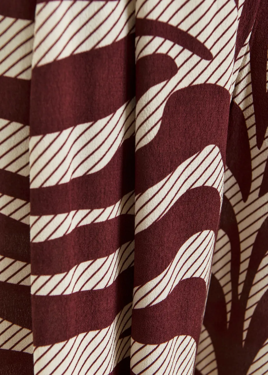 Pantalon large à imprimé zèbre blanc cassé et bordeaux