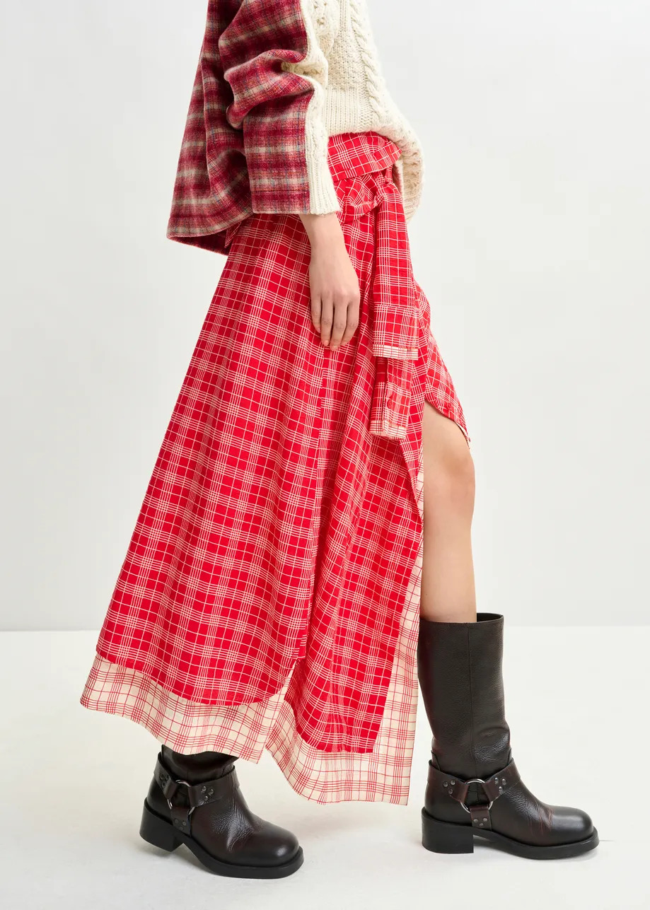 Red and off-white asymmetrical draped skirt with shirt-sleeve waist detail