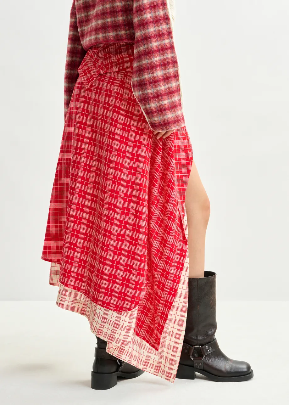 Red and off-white asymmetrical draped skirt with shirt-sleeve waist detail