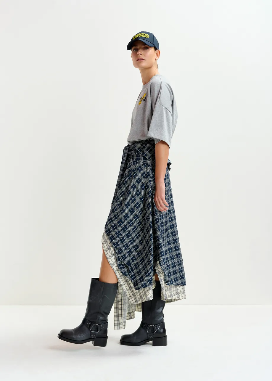 Navy and white asymmetrical draped skirt with shirt-sleeve waist detail
