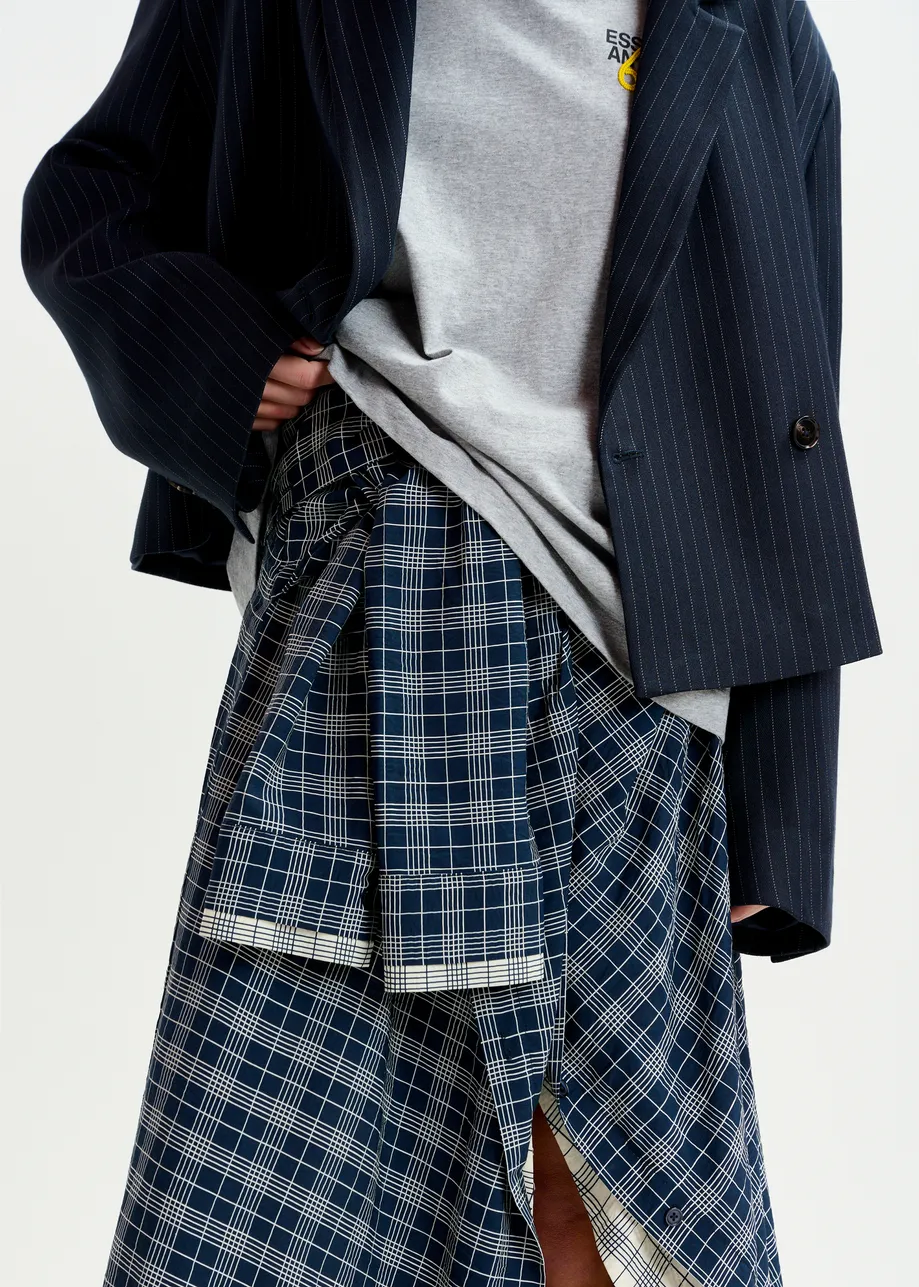 Navy and white asymmetrical draped skirt with shirt-sleeve waist detail