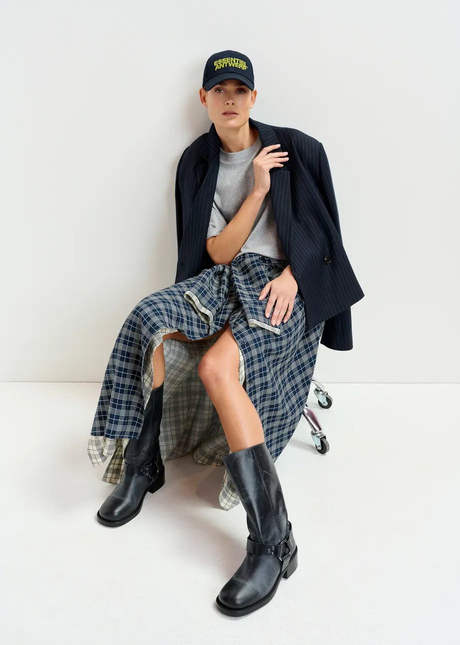 Navy and white asymmetrical draped skirt with shirt-sleeve waist detail