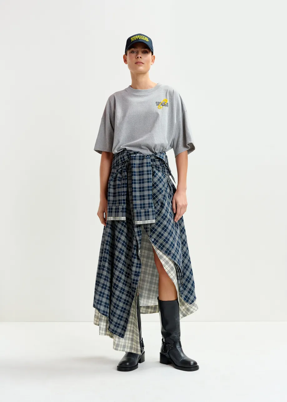 Jupe drapée asymétrique bleu marine et blanche avec manches chemise à la taille
