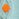 Light blue and orange polka-dot cable-knit sweater