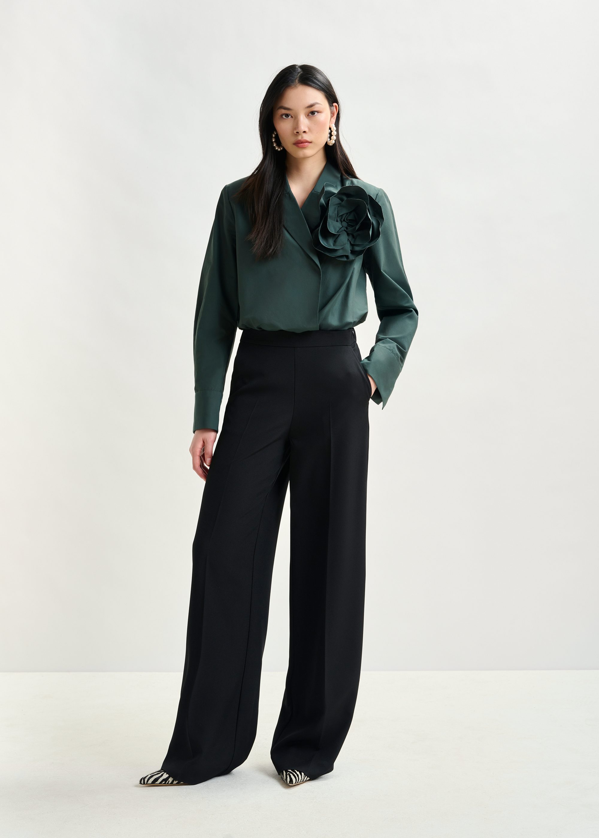 Black wide-leg pants with pressed crease | Essentiel Antwerp