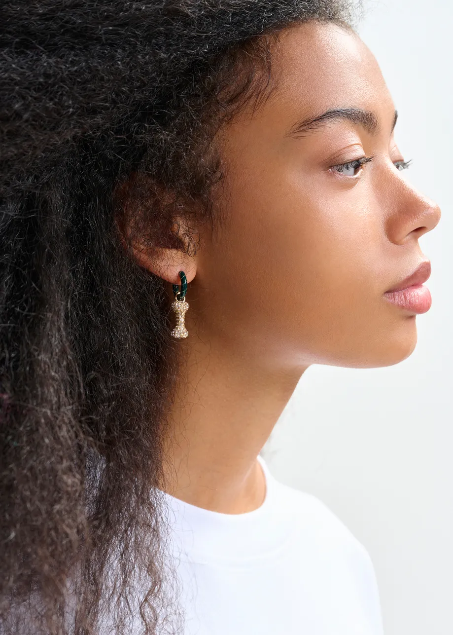 Dark green and gold hoop earrings with bunny and bone pendants