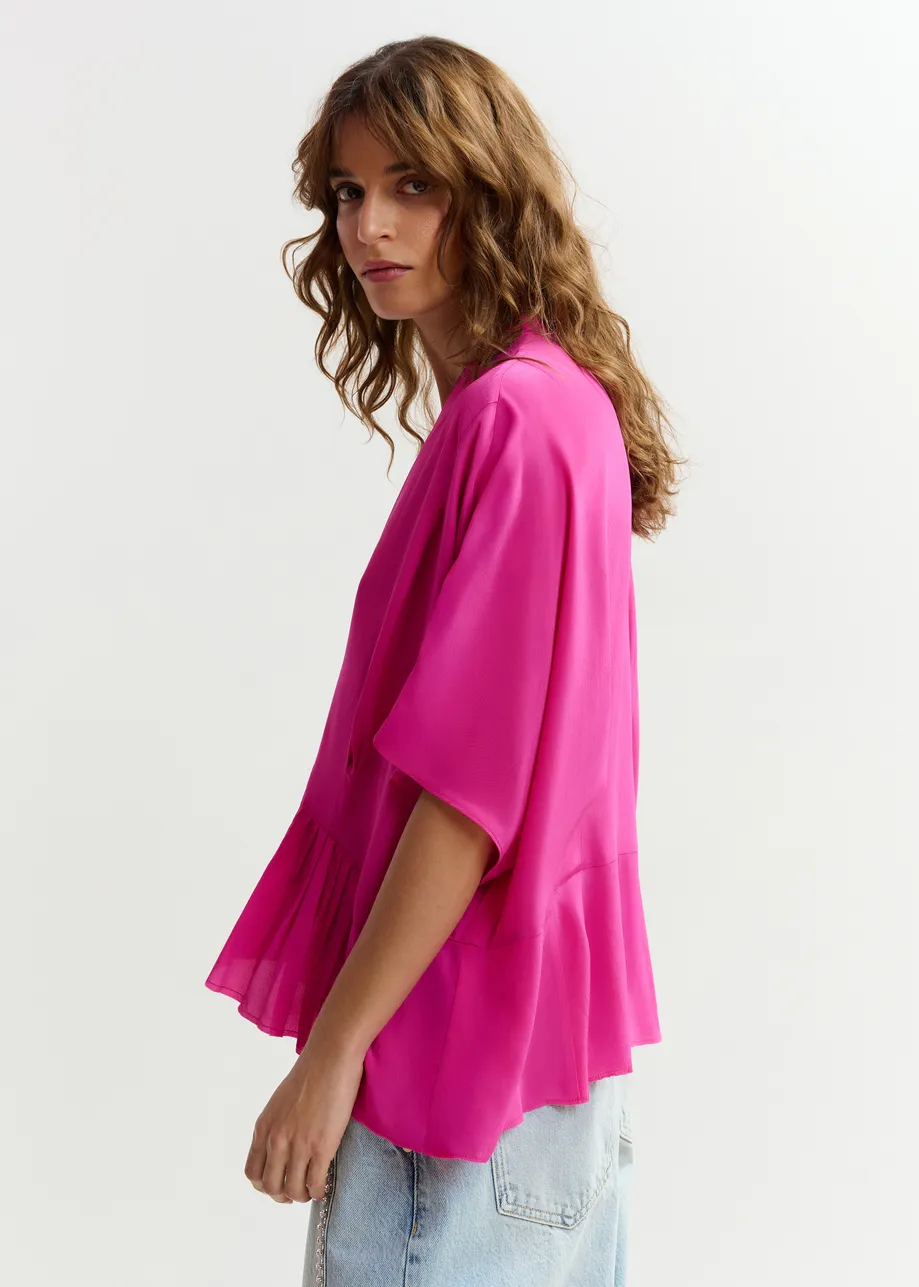 Roze oversized top met peplumzoom