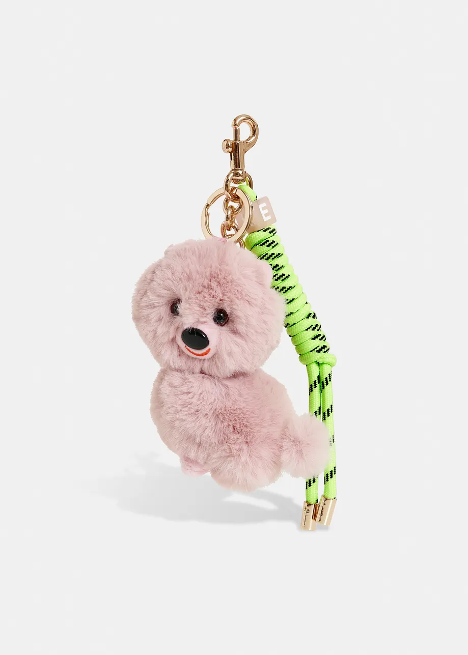 Light pink dog bag charm with bright yellow twisted cord detail